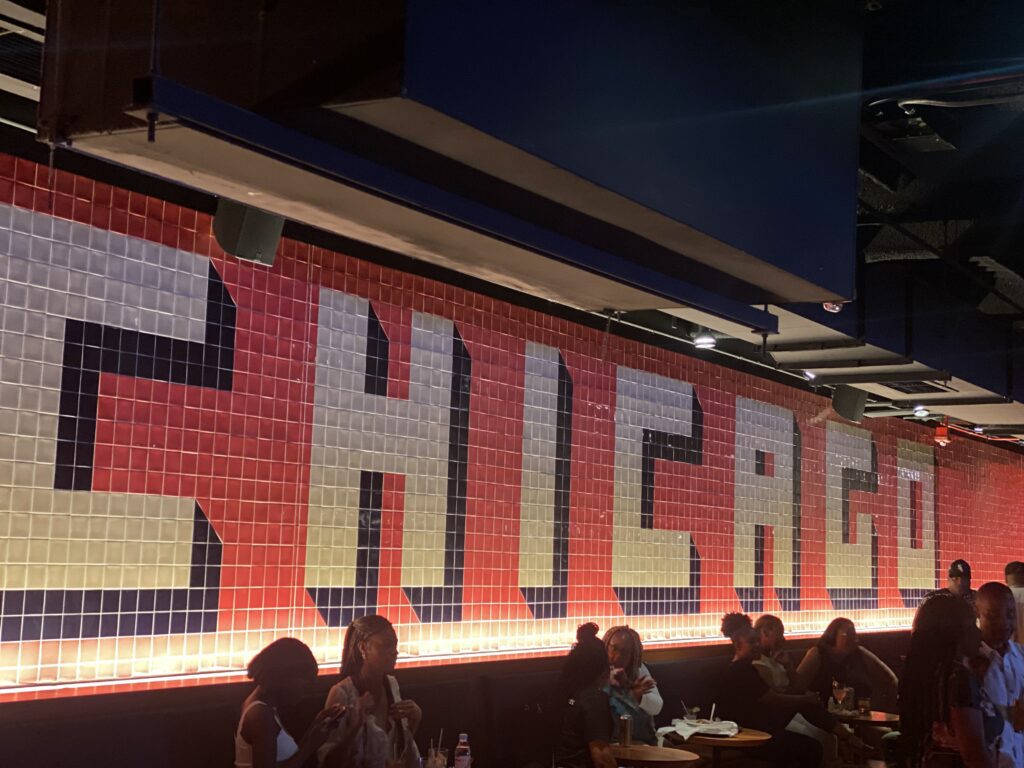 15 Unique Things to Do in Chicago (That You’ll Actually Remember) A Group Of People Sitting At A Table In A Restaurant